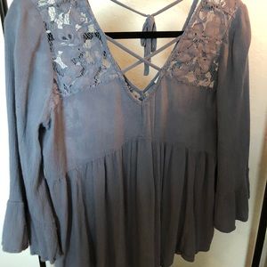 Dusty Blue criss cross v-neck blouse. Lace detail